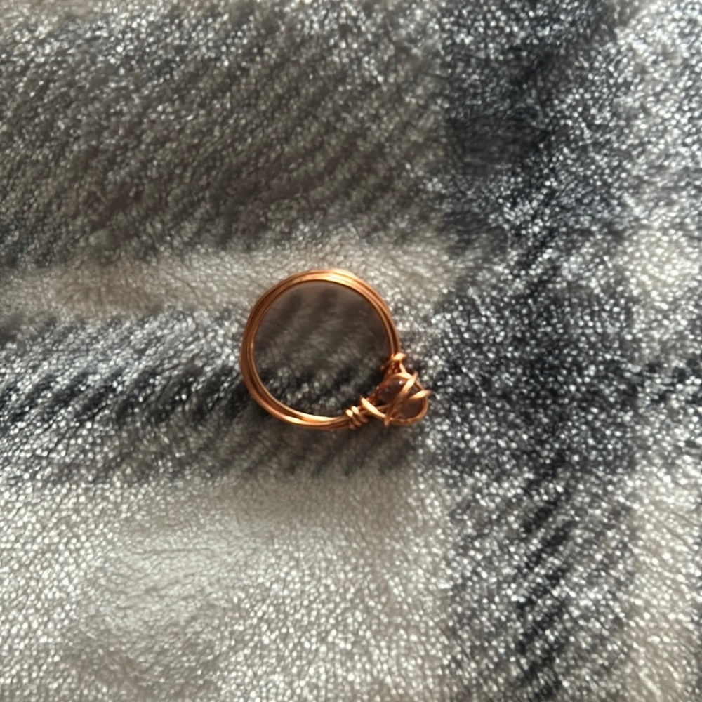 A copper ring very nice wire ring with a crystal wrapped